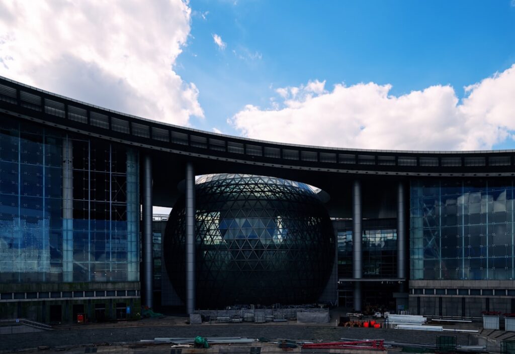 A large round building with a sky background