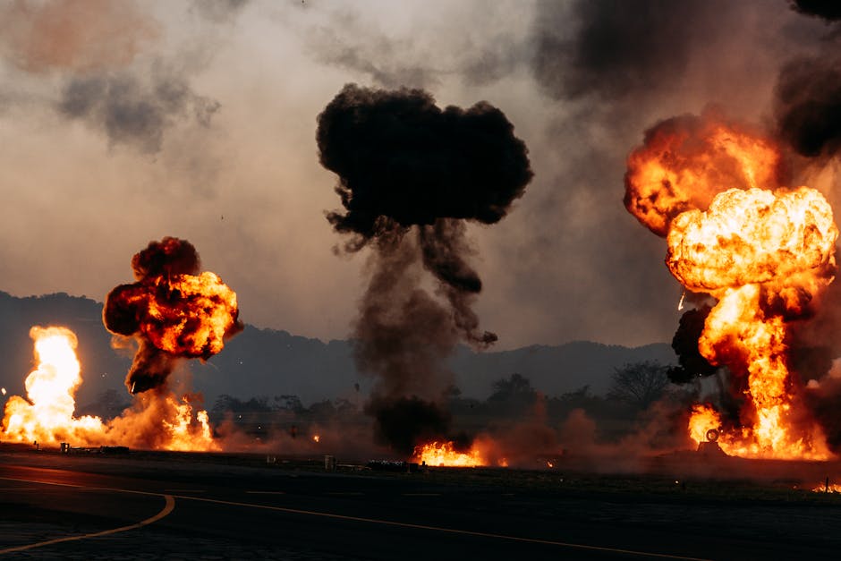 Intense outdoor scene with multiple fiery explosions creating dramatic clouds.