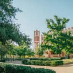 a college campus with a clock tower in the background