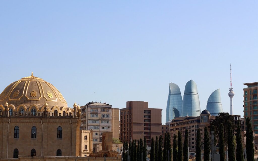 The Flame Towers and Baku TV tower seen from the gardens of Taza Pir Mosque.