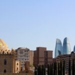The Flame Towers and Baku TV tower seen from the gardens of Taza Pir Mosque.