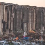 A large concrete structure lies in ruins, symbolizing the destruction in Beirut, Lebanon.