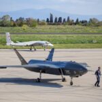 Advanced military drones on a tarmac in Istanbul, Turkey, showcasing modern aerial technology.