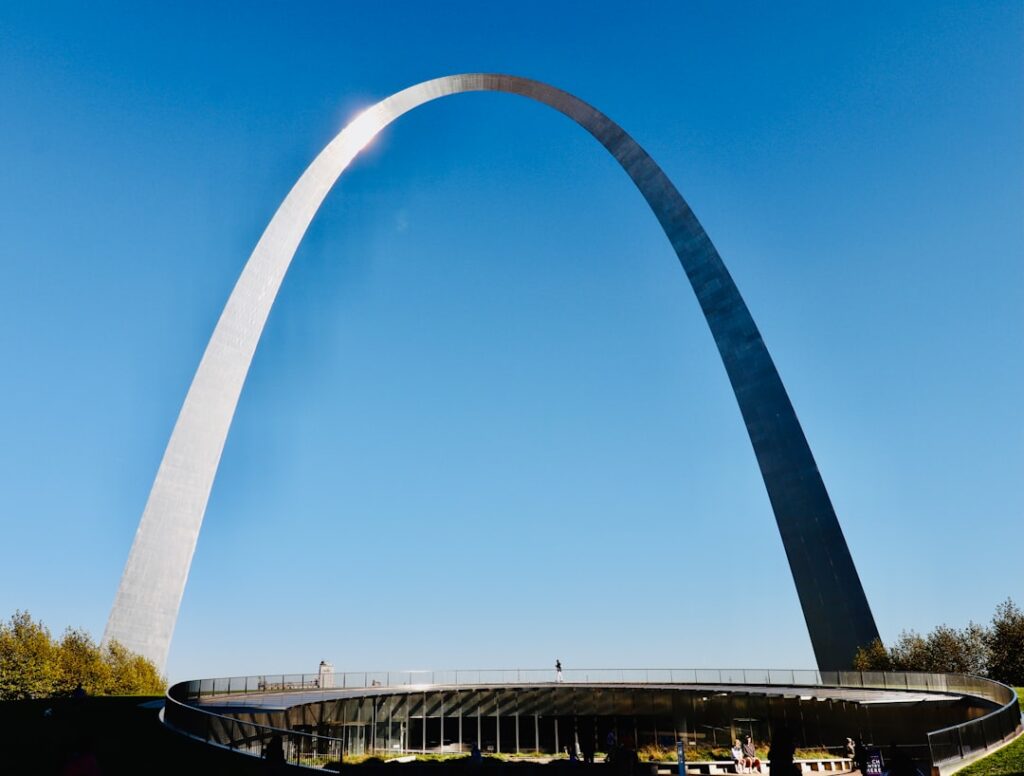 a very tall arch towering over a city