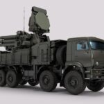 Detailed image of a military vehicle equipped with advanced radar and weaponry systems.